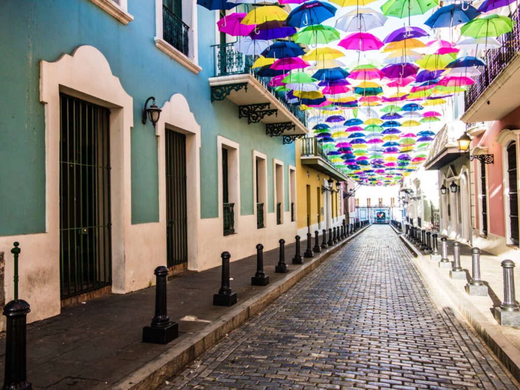 View of the colorful buildings and umbrellas in the historic district of San Juan
