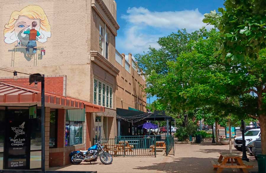 View of stores and wall art in Historic Downtown Greeley