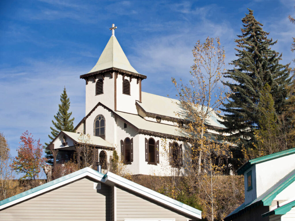 Exterior view of Historic Sacred Heart Parish against a clear blue sky