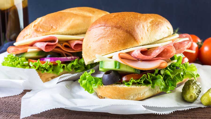 Ham, vegetables, and cheese on hoagie rolls
