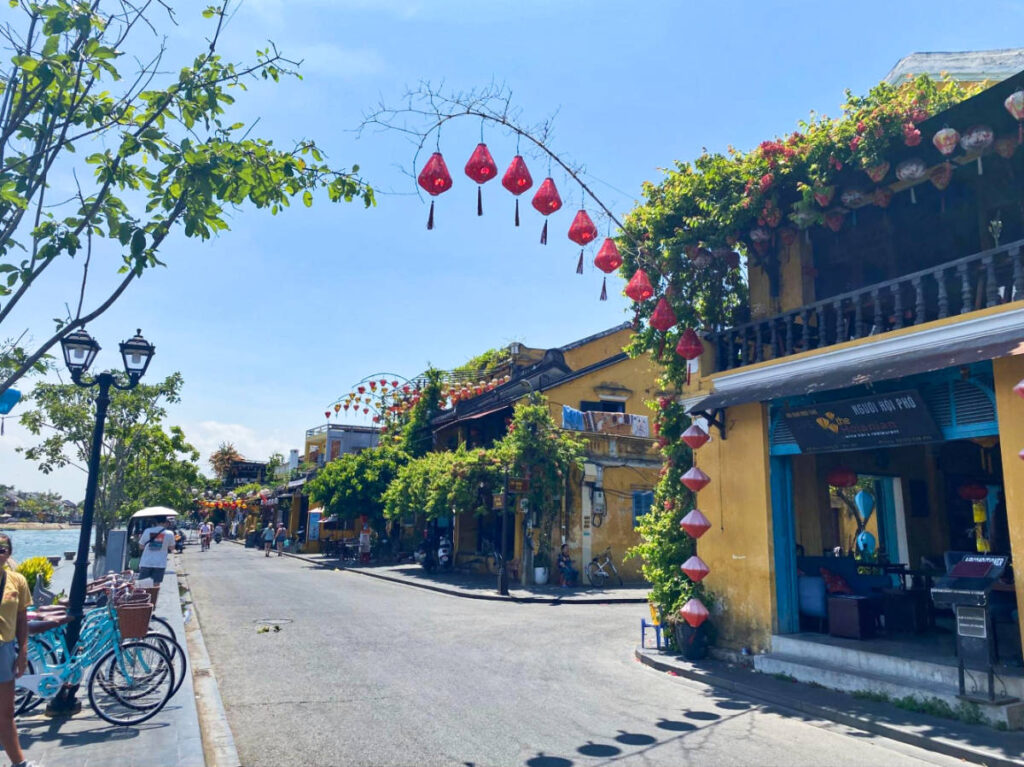 View of the lanterns over a waterfront street in Hoi An