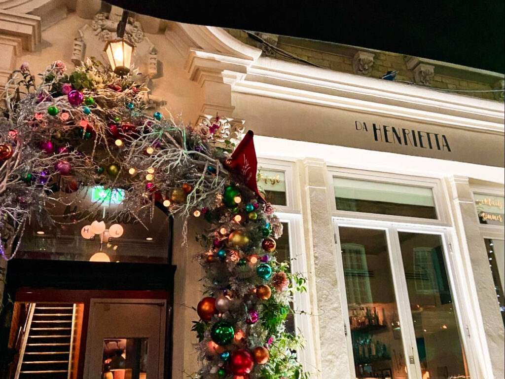 View of the festive holiday decorations at the entrance of Henrietta Hotel