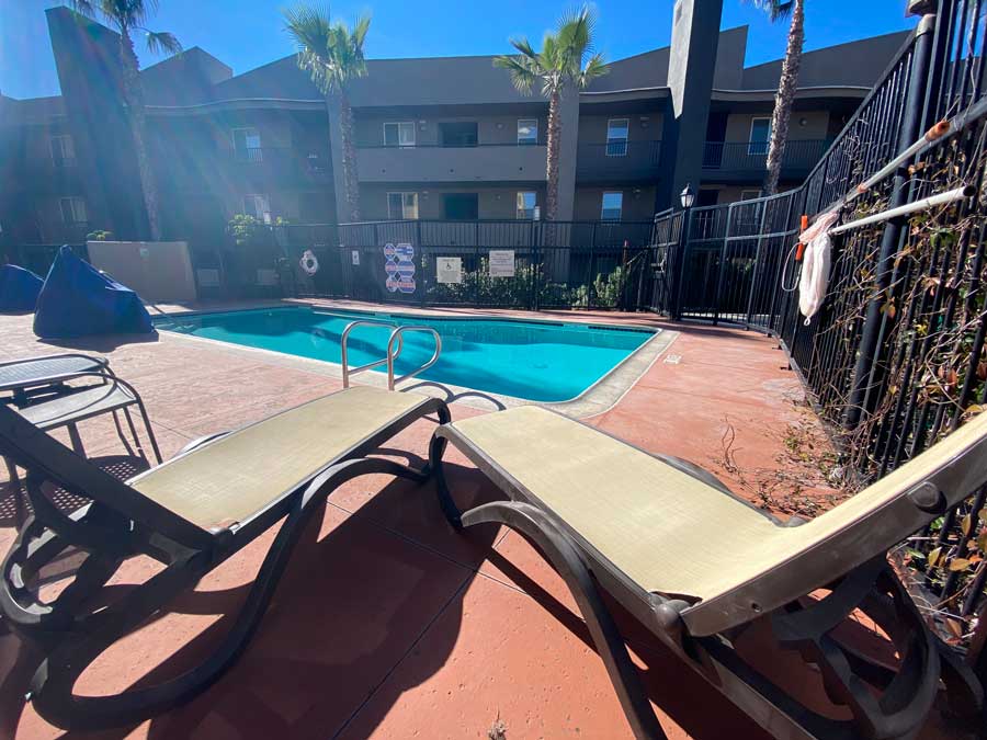 View of pool chairs and a pool in Holiday Inn Oceanside