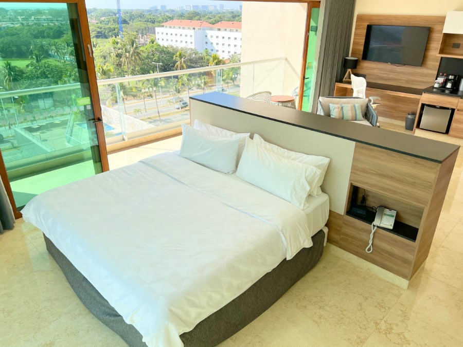 View of the bed inside the hotel room of Holiday Inn & Suites