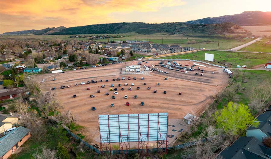 Aerial view of cars park in Holiday Twin Drive-In Theater