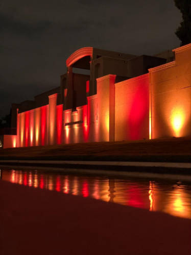 View of the illuminated exterior of Hollywood Forever Cemetery at night