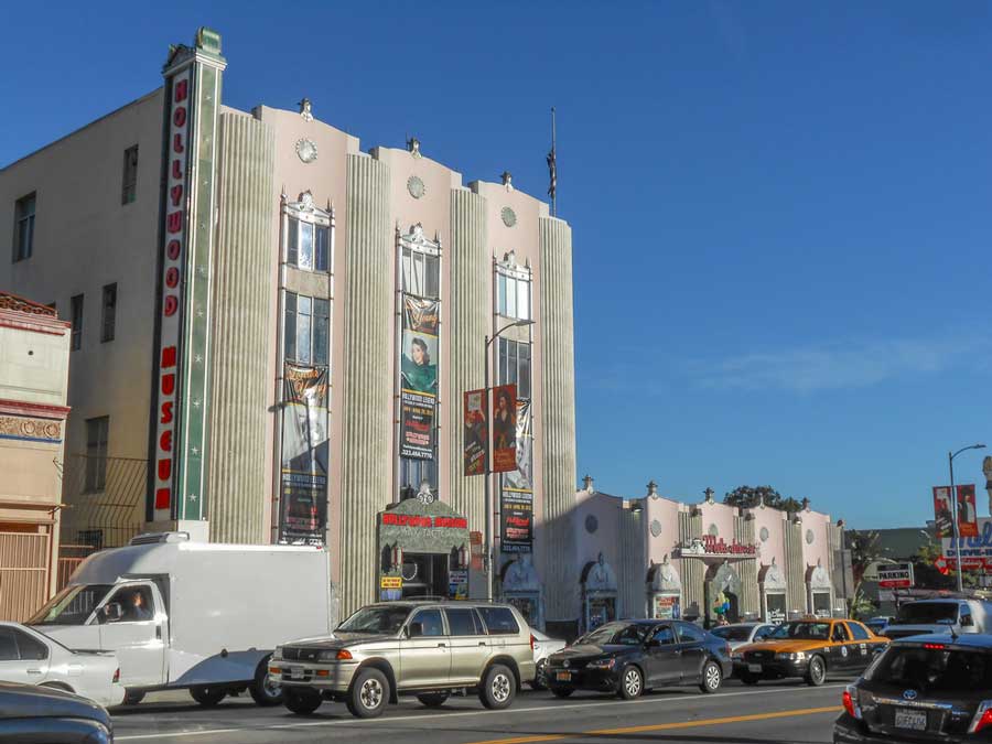 Cars passing by in front of the Hollywood Museum building