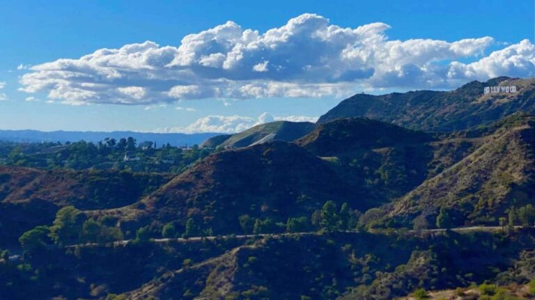 View of the Hollywood sign from afar and the mountains surrounding it