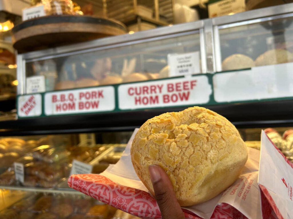 Holding a BBQ pork hom bow from Mee Sum Pastry