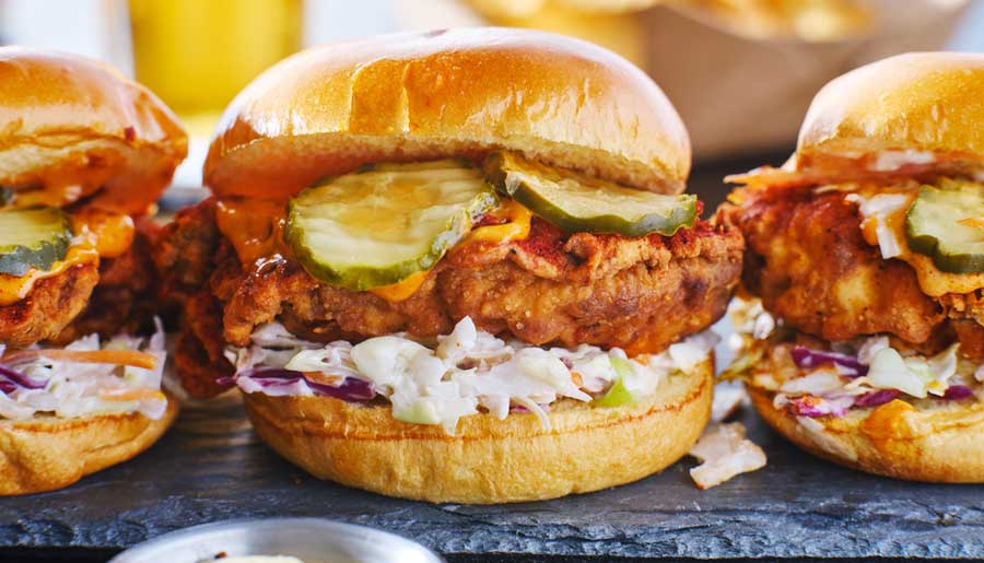 Chicken sandwiches on a wooden board