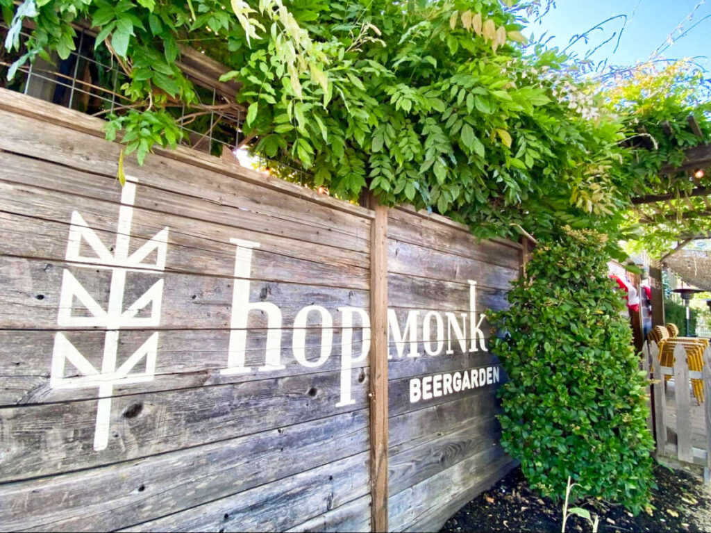 View of the signage of HopMonk BEERGARDEN at the outdoor space