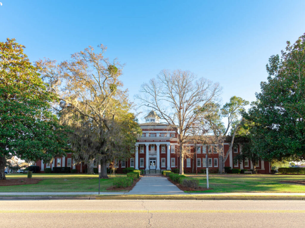 Panoramic view of the exterior of Horry County Courthouse seen from across the street