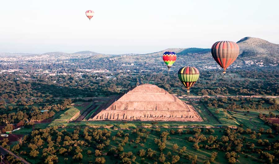 Colorful hot air balloons over Teotihuacan