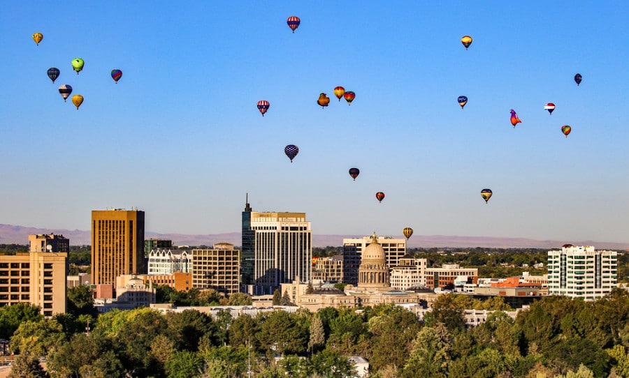Hot air balloons above the cityscape of downtown Boise