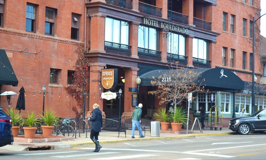 View of people walking in front of Hotel Boulderado
