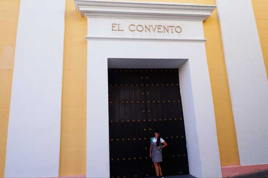 The author posing for a photo in front of Hotel El Convento