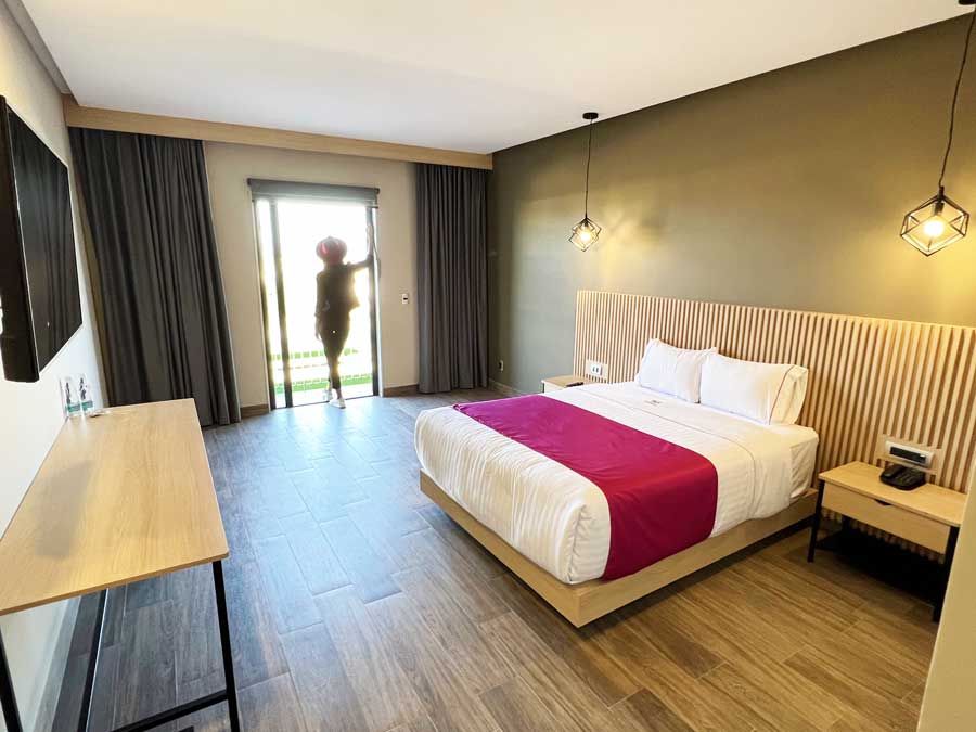 Clara standing on a bedroom in Hotel MX