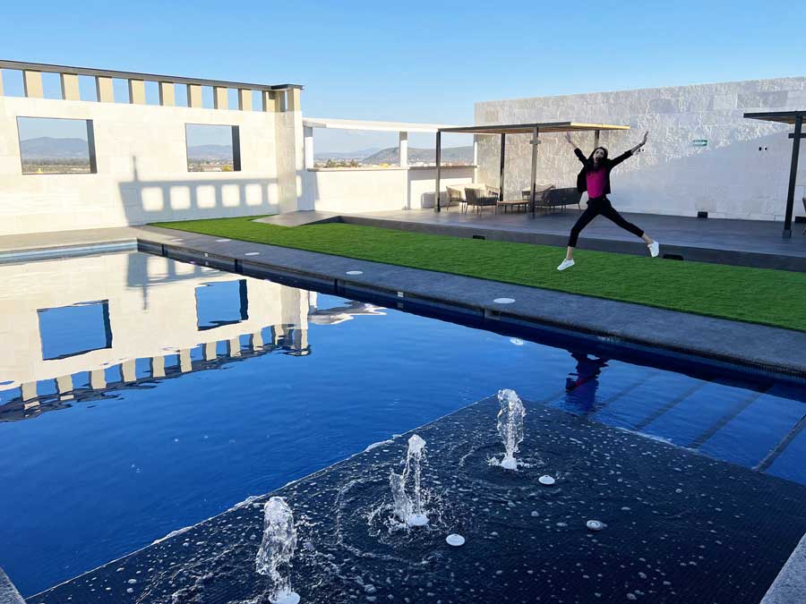 View of Clara enjoying her day in Hotel MX pool area