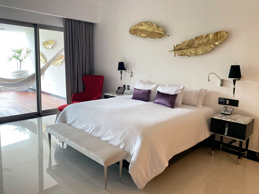 View of a bed inside a room in Hotel Mousai