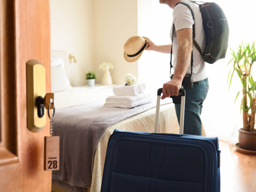A guest entering his hotel room