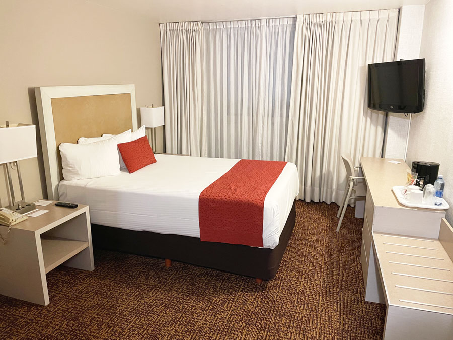 View of bedroom with a television in Hotel Stanza