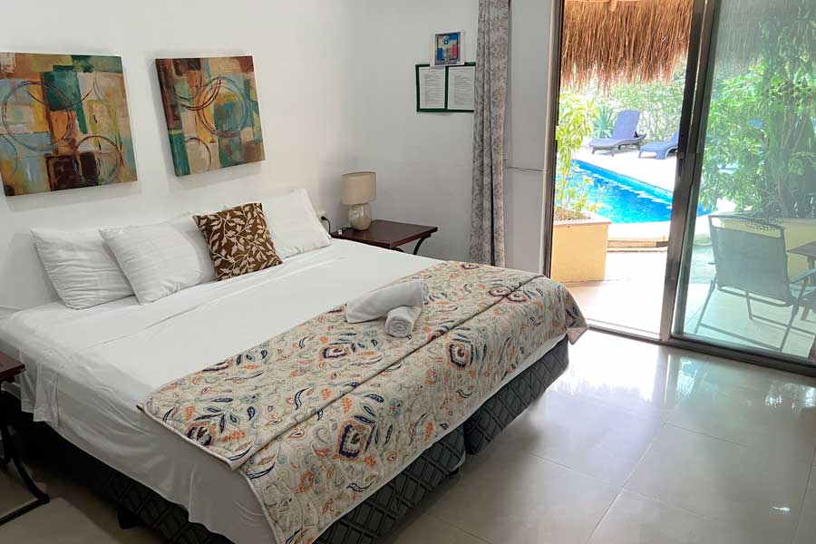 View of the bed inside a room in Hotel Villas Akalan