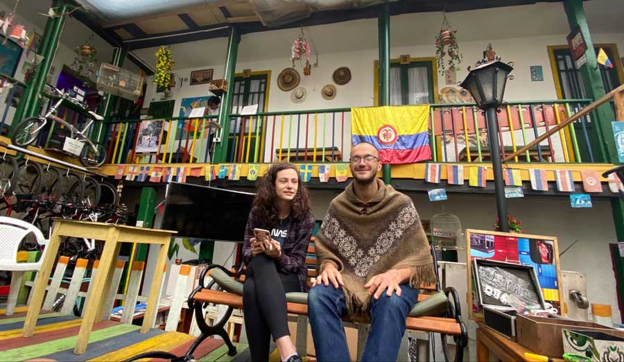 The author's friends sitting on a colorful hotel in Bogota
