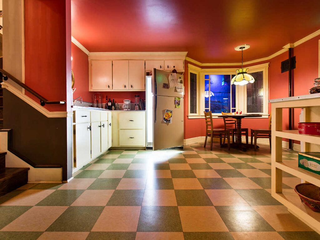 A cozy house interior and the opened fridge door in the House of Eternal Return