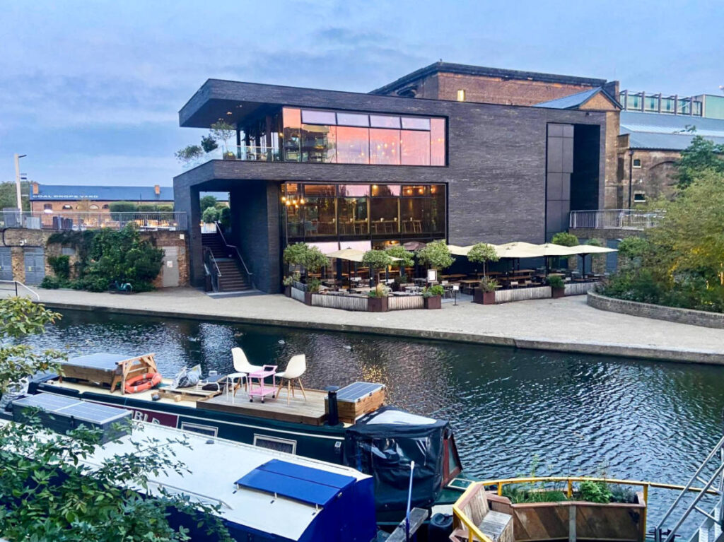 Overlooking view of the houseboat on the water in Coal Drops Yard