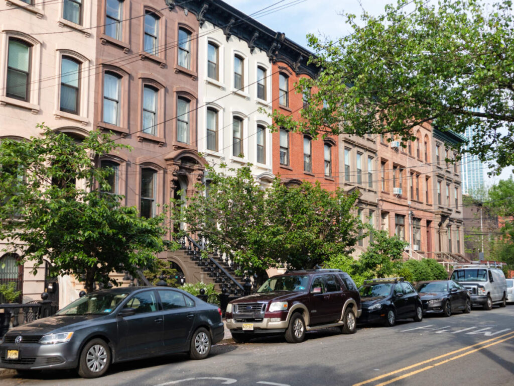 Cars parked outside the brownstone houses in Jersey City