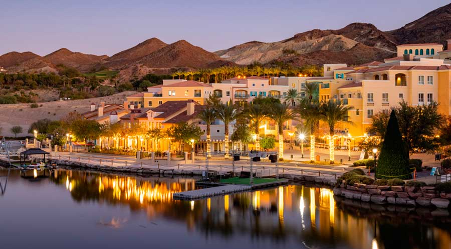 View of houses with lights at night in Lake Las Vegas