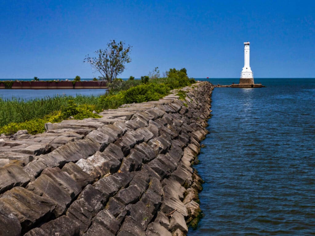 View of the Huron Harbor lighthouse near Nickel Plate Beach on a sunny day
