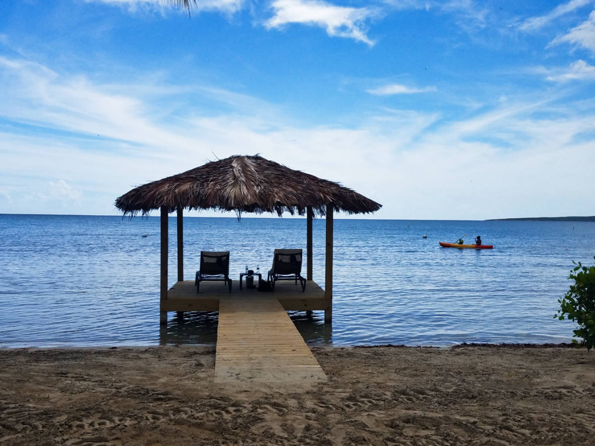 A hut with lounge chairs on the dock at Copamarina Beach Resort