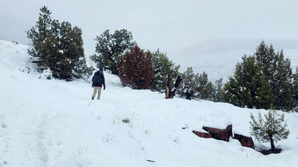 The author, Abigail, walking at the top of the hill while carrying the Hyperlite Mountain Gear Southwest Backpack