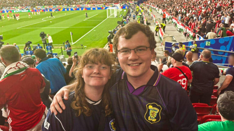 The author Louise Wylie and her partner at the game in Germany