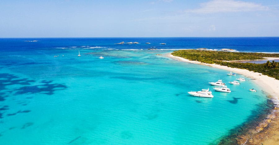 Aerial view of Icacos Beach and some yacht and small boat on it