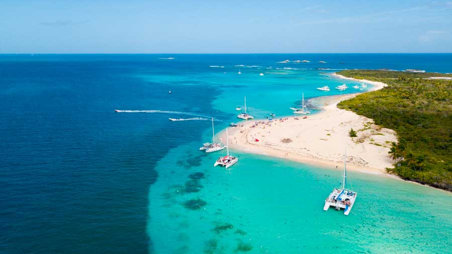 Aerial view of boats in the turquoise water of Icacos Island