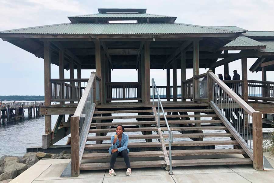 The author enjoying her ice cream while sitting on a staircase in Port Townsend