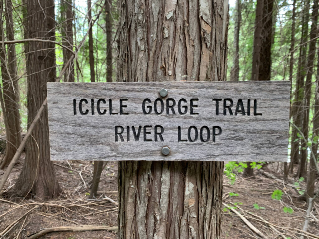 The wooden hiking signage of Icicle Gorge Trail