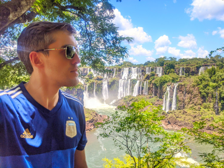 Nate Hake posing with the falls on the Lower Circuit
