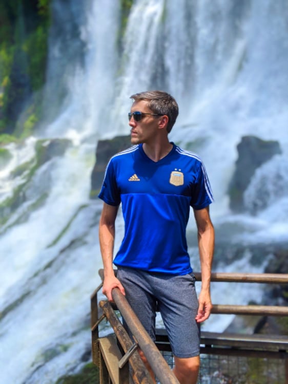 Nate Hake in an Argentina football jersey, with waterfalls in the background
