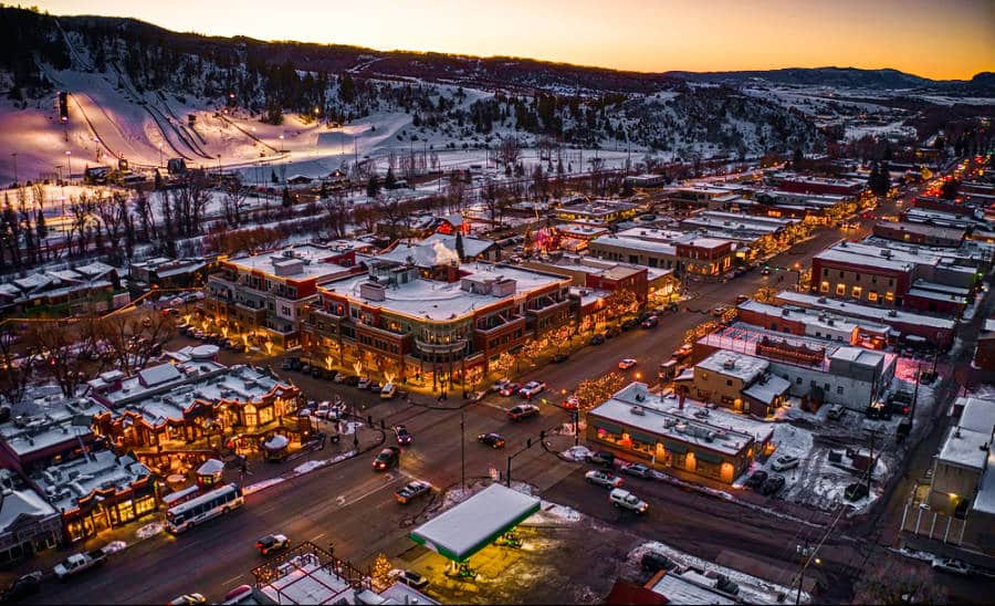 Aerial view of the illuminated Colorado Ski Town during winter