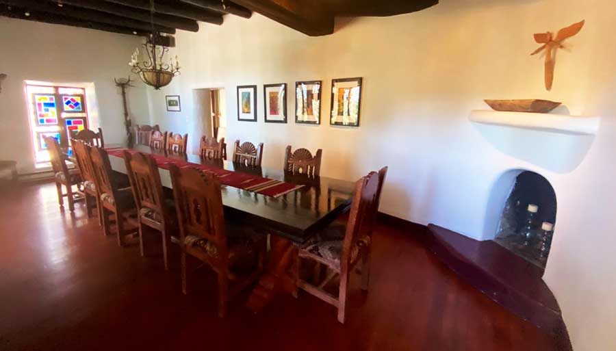 A long table and chairs at the dining room of Inn of the Turquoise Bear