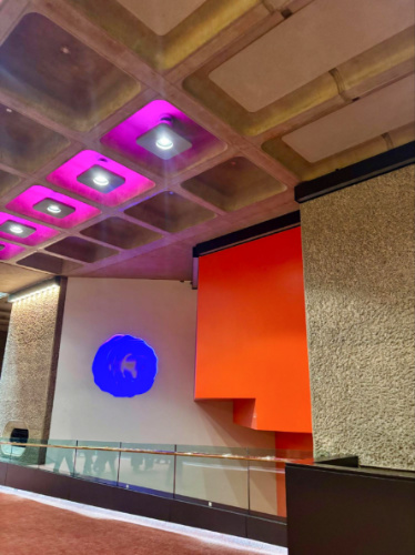 View of the colorful art installation and lights inside the Barbican Centre