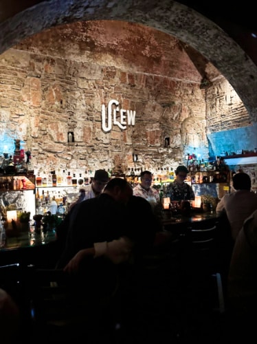 View of the people at the bar counter of Ulew Cocktail Bar