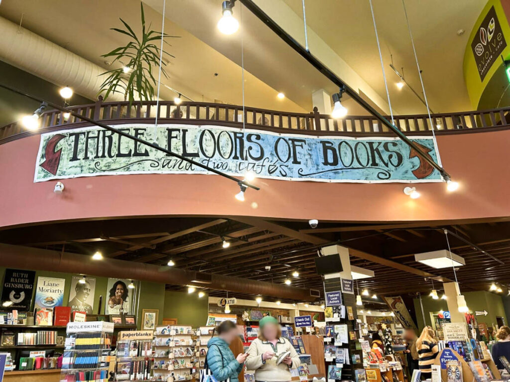 People looking at the books inside Village Books and Paper Dreams