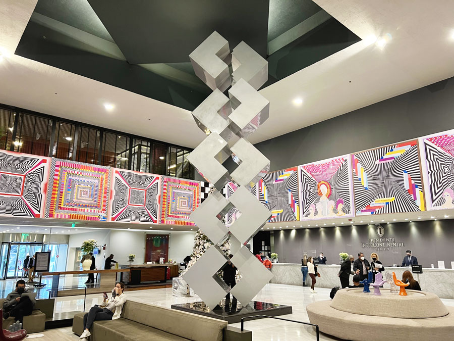 View of a people in the lounge area with a big sculpture in the middle in Intercontinental Presidente