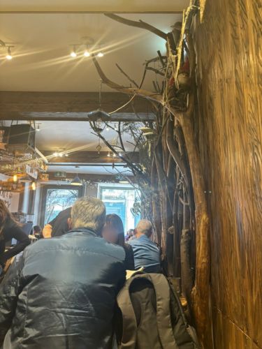 People dining inside Floresta Cafe