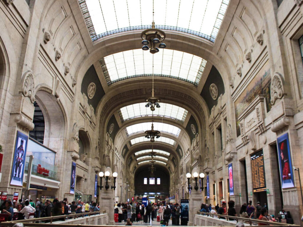 View of the interior and the crowd inside the Milan Central Train Station