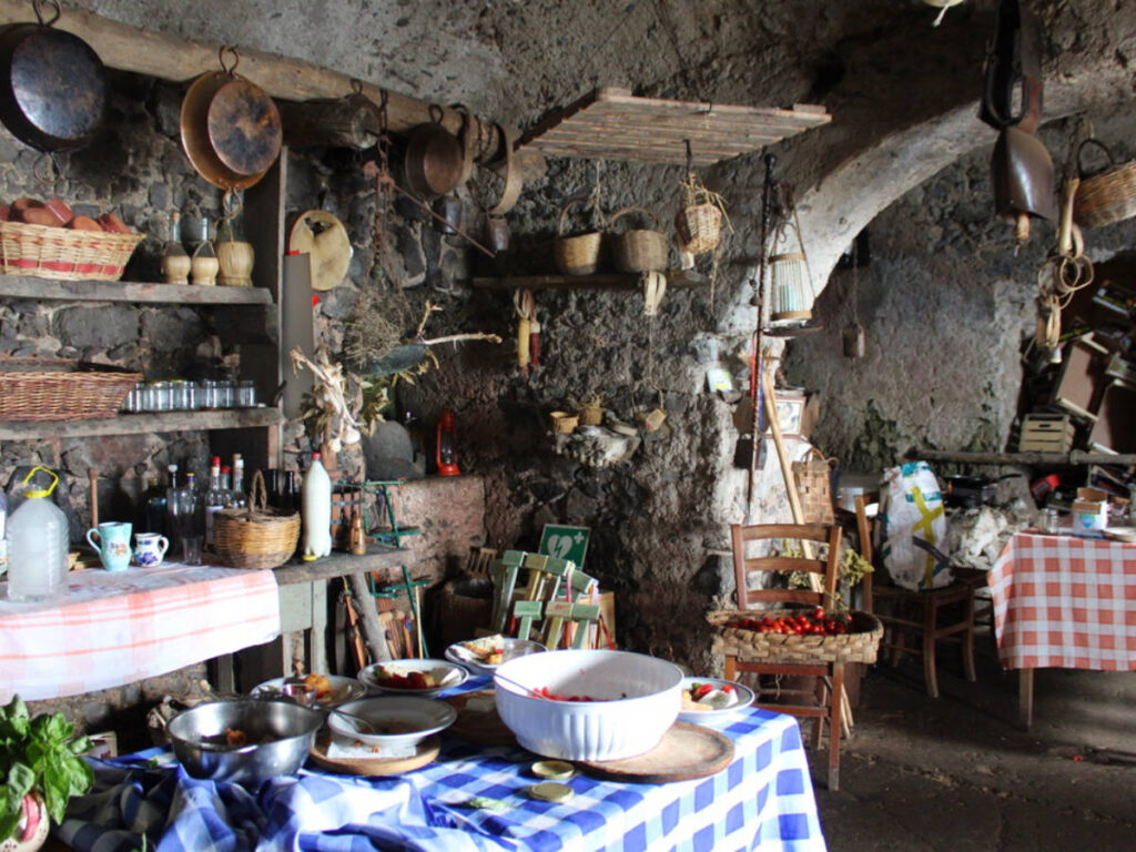 Inside a small homestead, a kitchen setup with a table and chairs